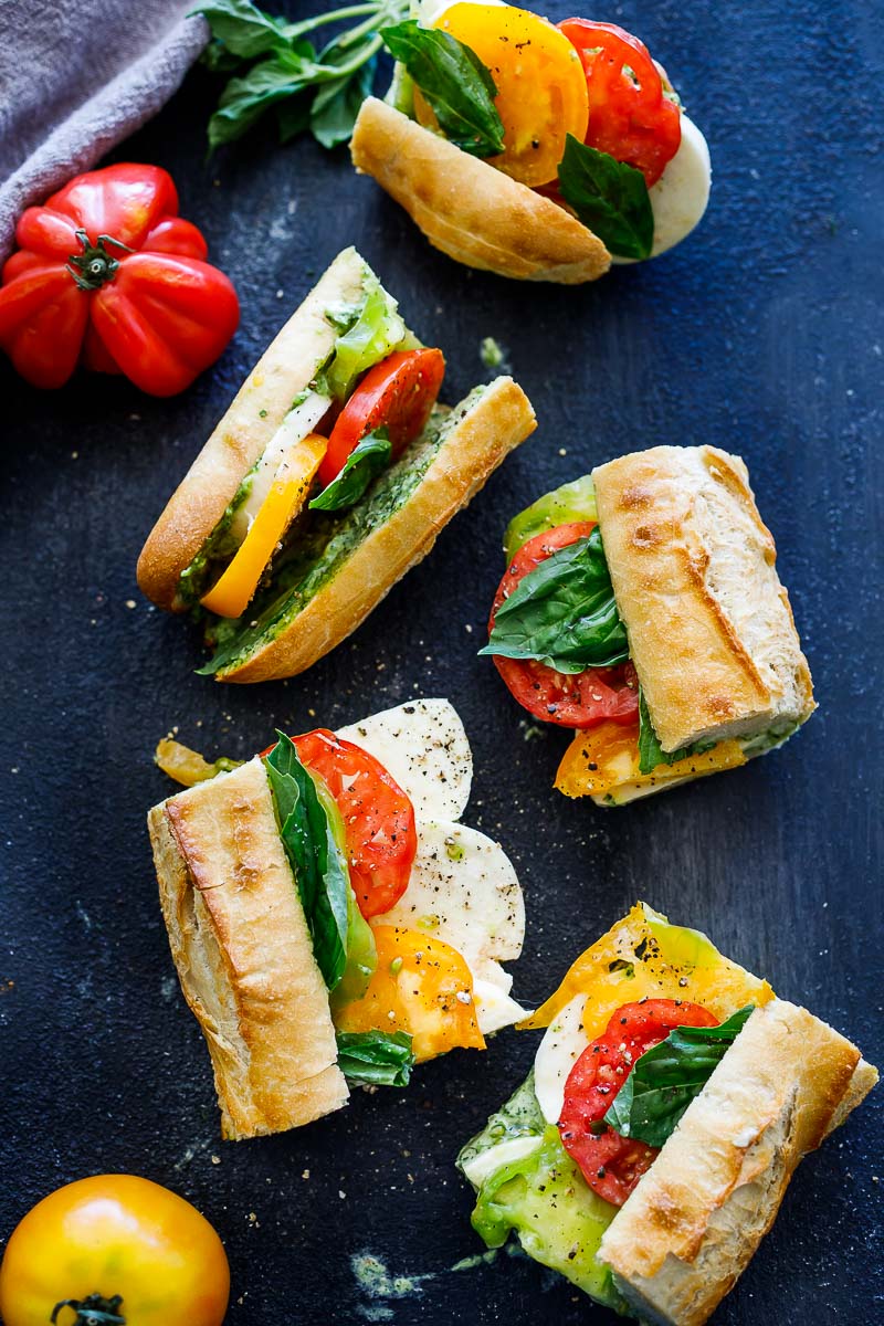 These Caprese Sandwiches are the perfect summer lunch- made with juicy ripe tomatoes, fresh mozzarella cheese, fresh basil, and pest0-mayo on a baguette, they are great made ahead or packed for picnic lunches on the go.
