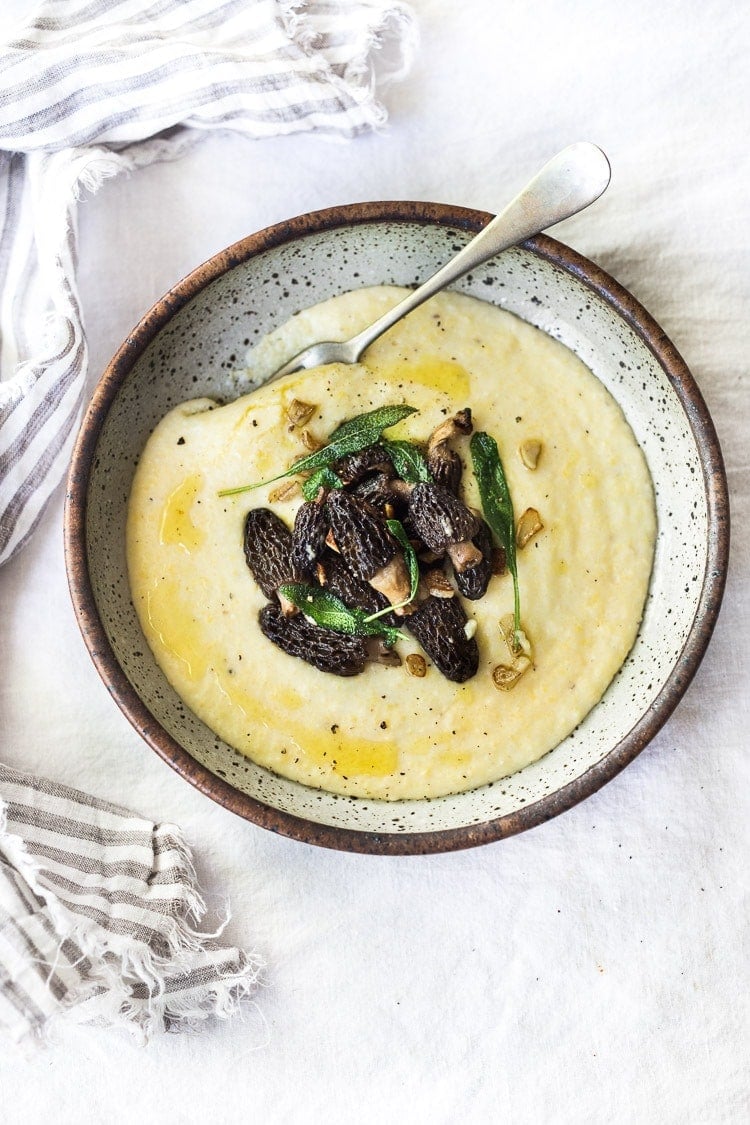 bowl with creamy mushroom polenta and crispy sage, with drizzle of truffle oil.