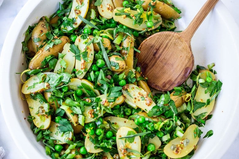 Potato Pea Salad with an herby Tarragon dressing. This zesty, vegan potato salad is loaded with fresh herbs and flavor! A delicious, healthy salad that can be made ahead. #potatosalad