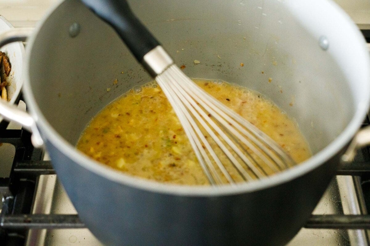 whisking in the pasta water and miso paste.