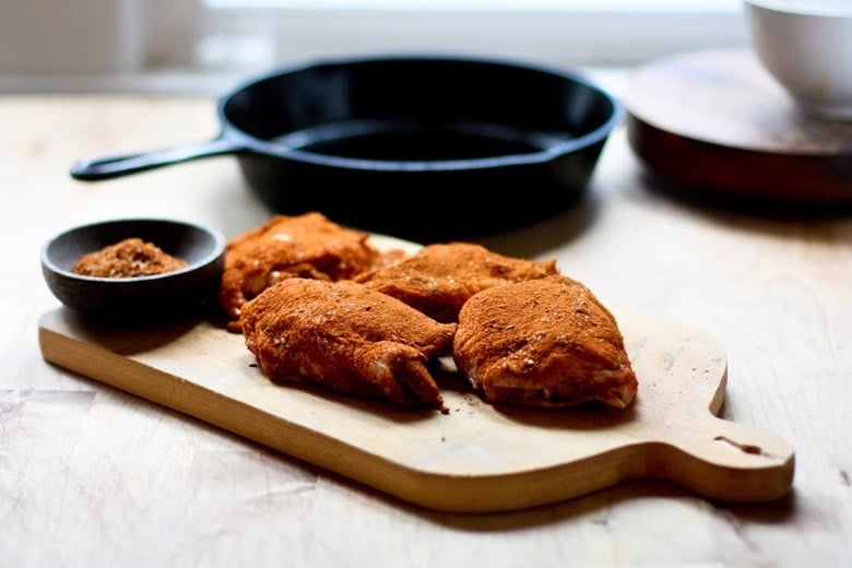 A deliciously flavorful recipe for Berbere Chicken over Ethiopian spiced Lentils with an easy recipe for Berbere Spice Blend. | www.feastingathome.com