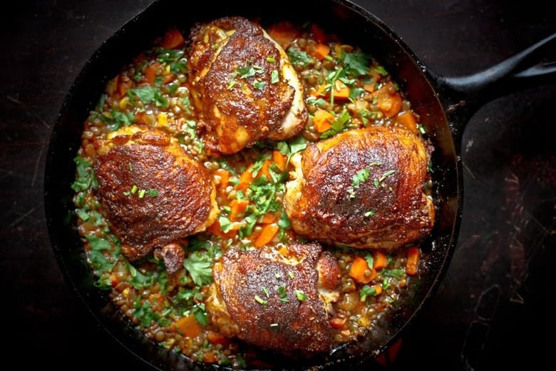 A deliciously flavorful recipe for Berbere Chicken over Ethiopian spiced Lentils with an easy recipe for Berbere Spice Blend. | www.feastingathome.com