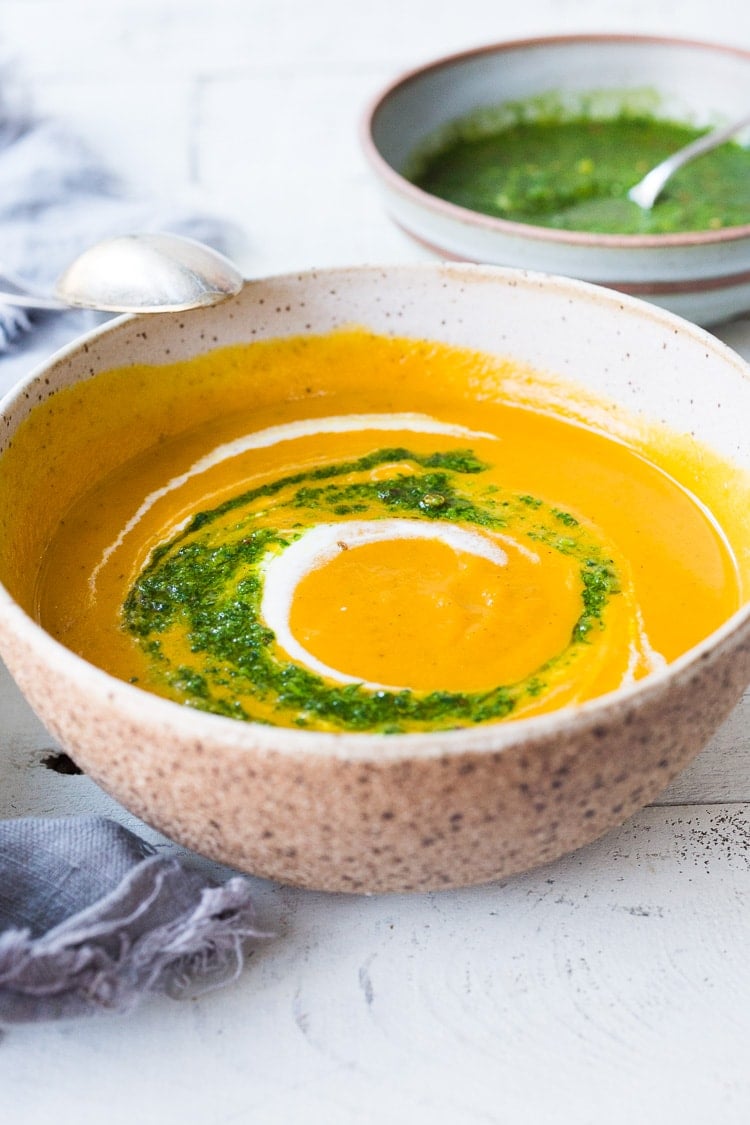 Carrot Soup with Chermoula and North African Spices - a simple healthy soup bursting with flavor. Vegan Adaptable! #carrotsoup #carrots #vegan #chermoula