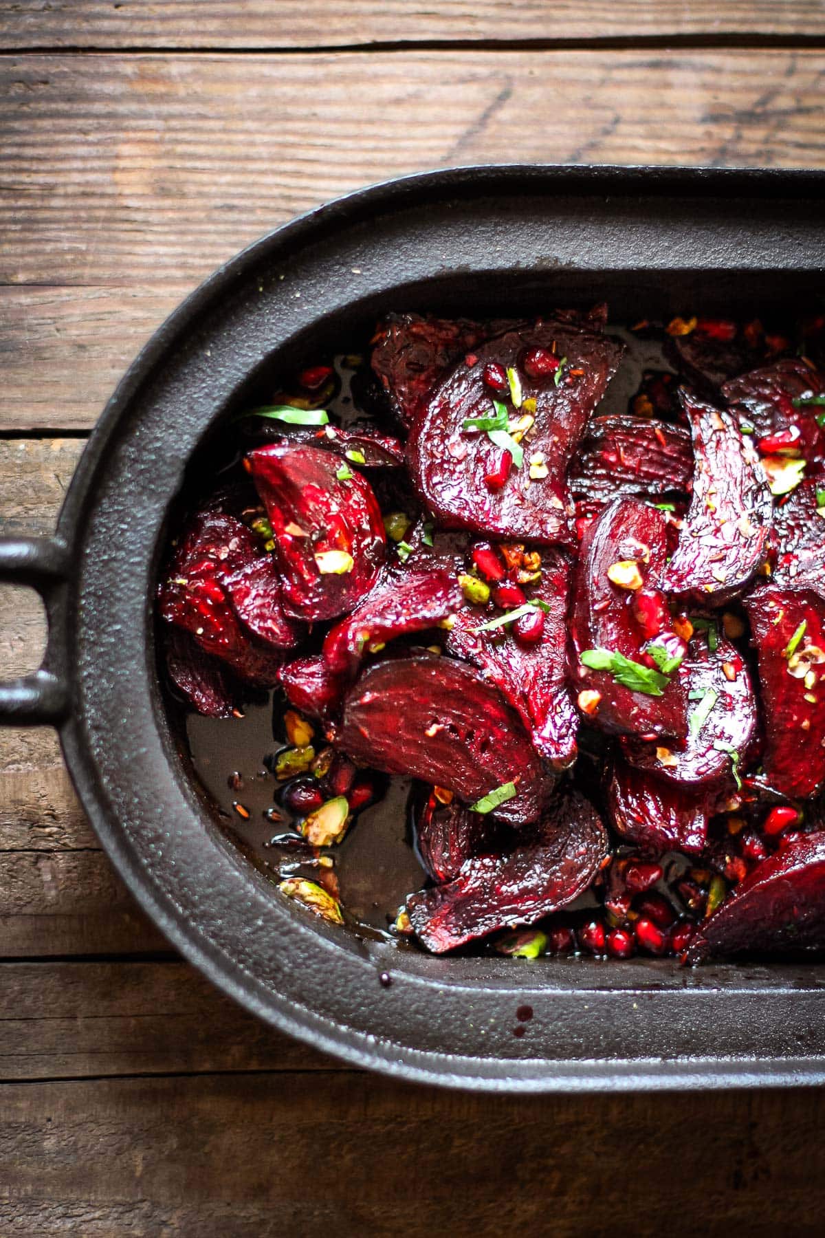 Tender and flavorful, Moroccan Roasted Beets with pomegranate seeds, toasted pistachios, and a simple balsamic glaze. A delicious, healthy side dish! 