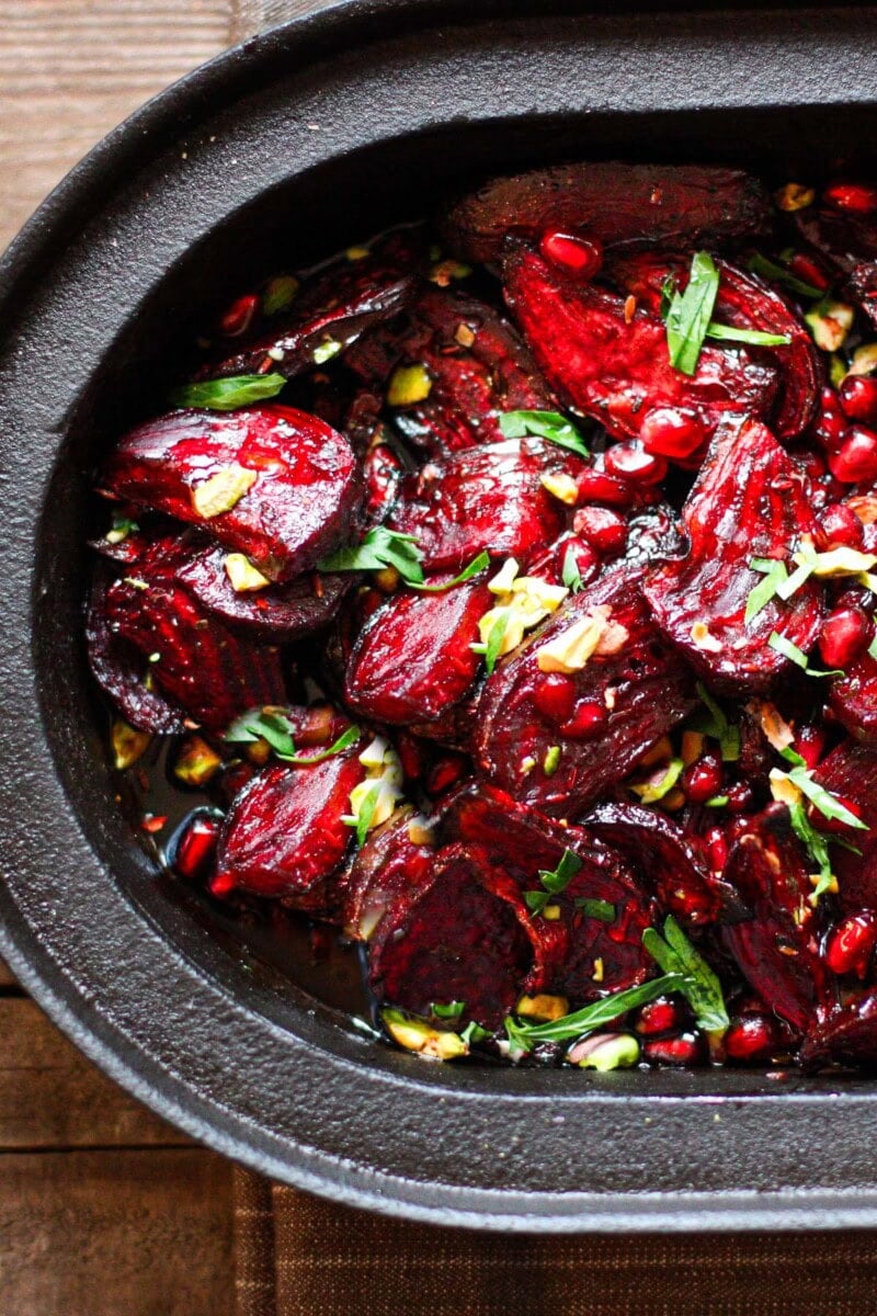 Tender and flavorful, Moroccan Roasted Beets with pomegranate seeds, toasted pistachios, and a simple balsamic glaze. A delicious, healthy side dish! 