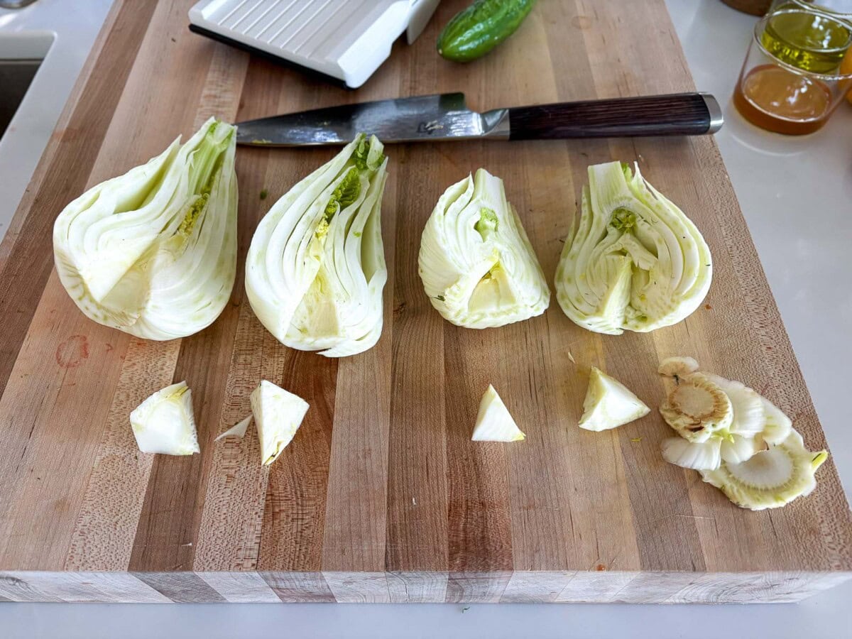 trimming, halving and coring the fennel bulbs- prepping them for the mandolin. 