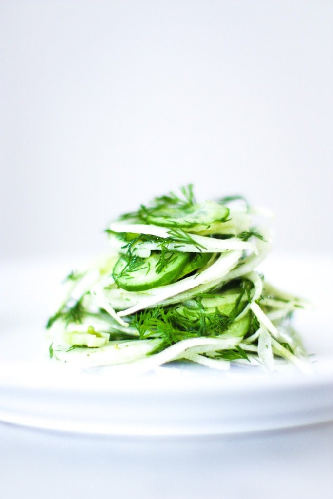 Fennel Cucumber Salad layered on a white plate.