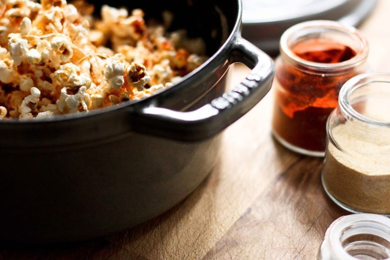 seasoning homemade popcorn.
