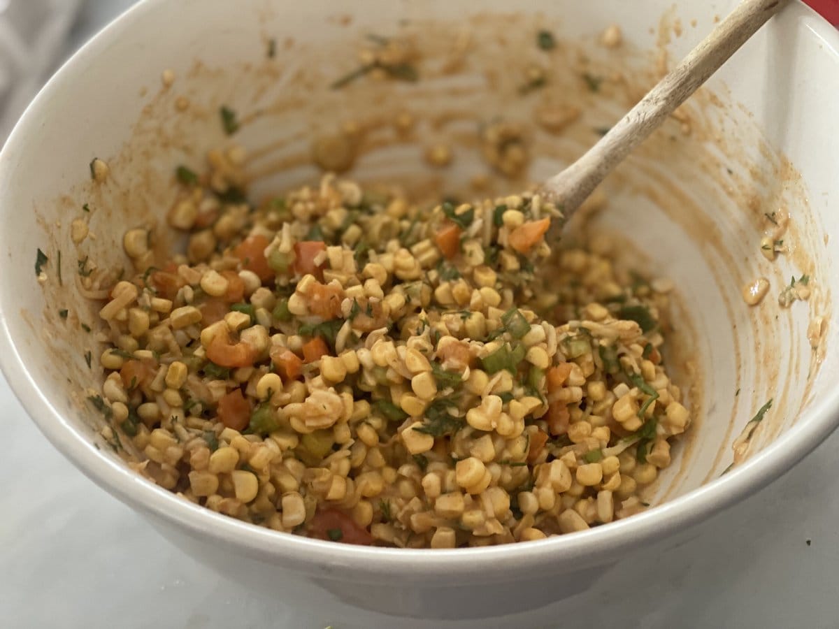 Celebrate the bounty of summer with fresh Corn Fritters!  A flavorful recipe that works as a tasty appetizer, hearty side dish, or a vegetarian main course. Serve with creamy Cilantro Sauce!