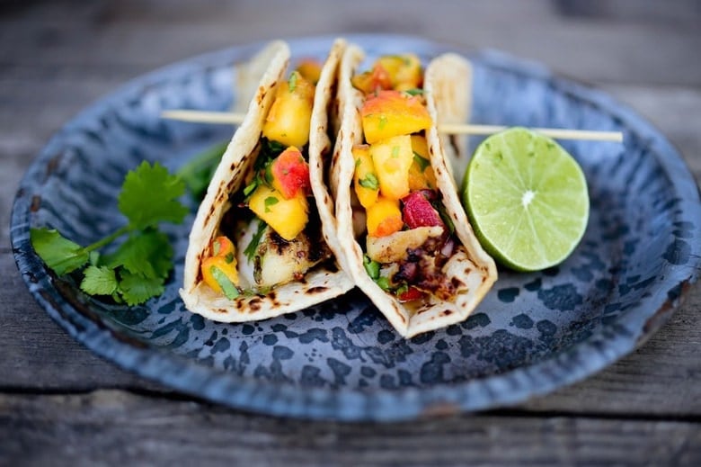 Grilled Chipotle Fish Tacos with a refreshing Peach Salsa. Summery and light with a little bit of heat. #fishtacos #peaches #peachsalsa #peach #chipotle #grilling