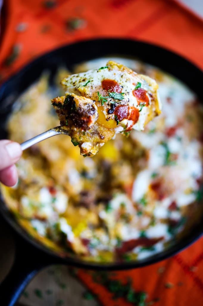 Creamy Polenta with poached eggs, chorizo and cilantro- a flavorful hearty brunch! #polenta #eggs #chorizo #brunch #breakfast #brunchrecipes #polentaeggs