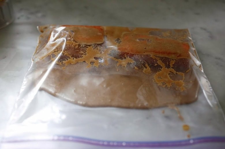 marinating the salmon in a zip lock bag.