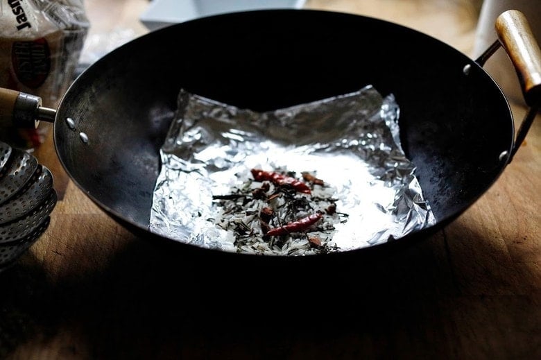 smoking ingredients, placed on foil in the wok.