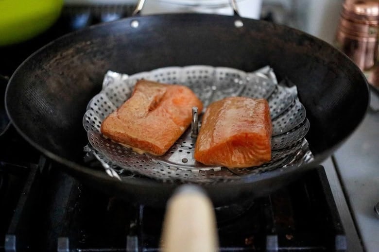 salmon placed on the steamer basket.