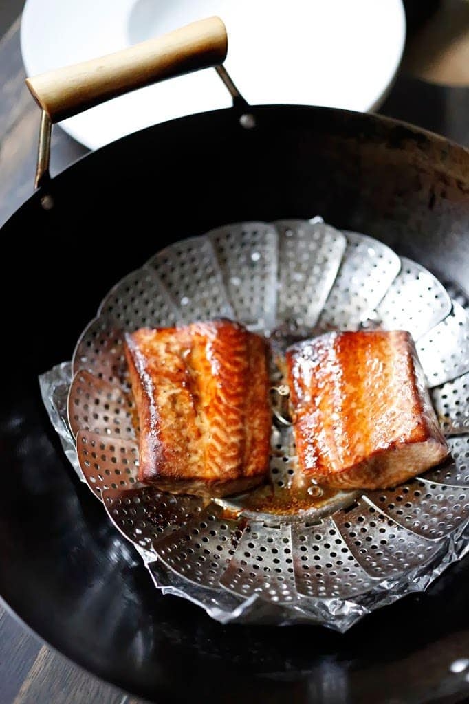 The foil removed, smoked salmon in a wok.