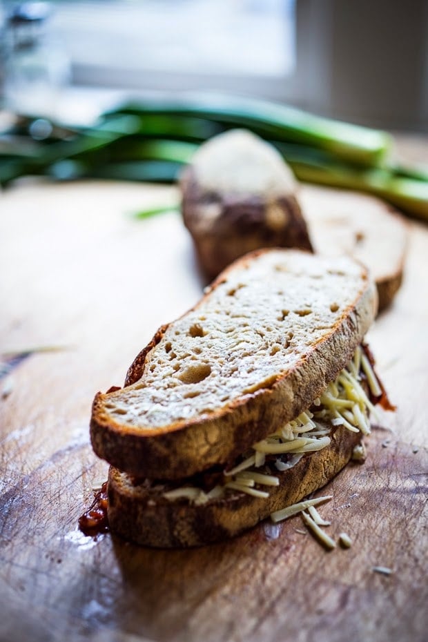 sandwich with rustic bread, caramelized onions, and grated gruyere cheese - before going in the skillet. 