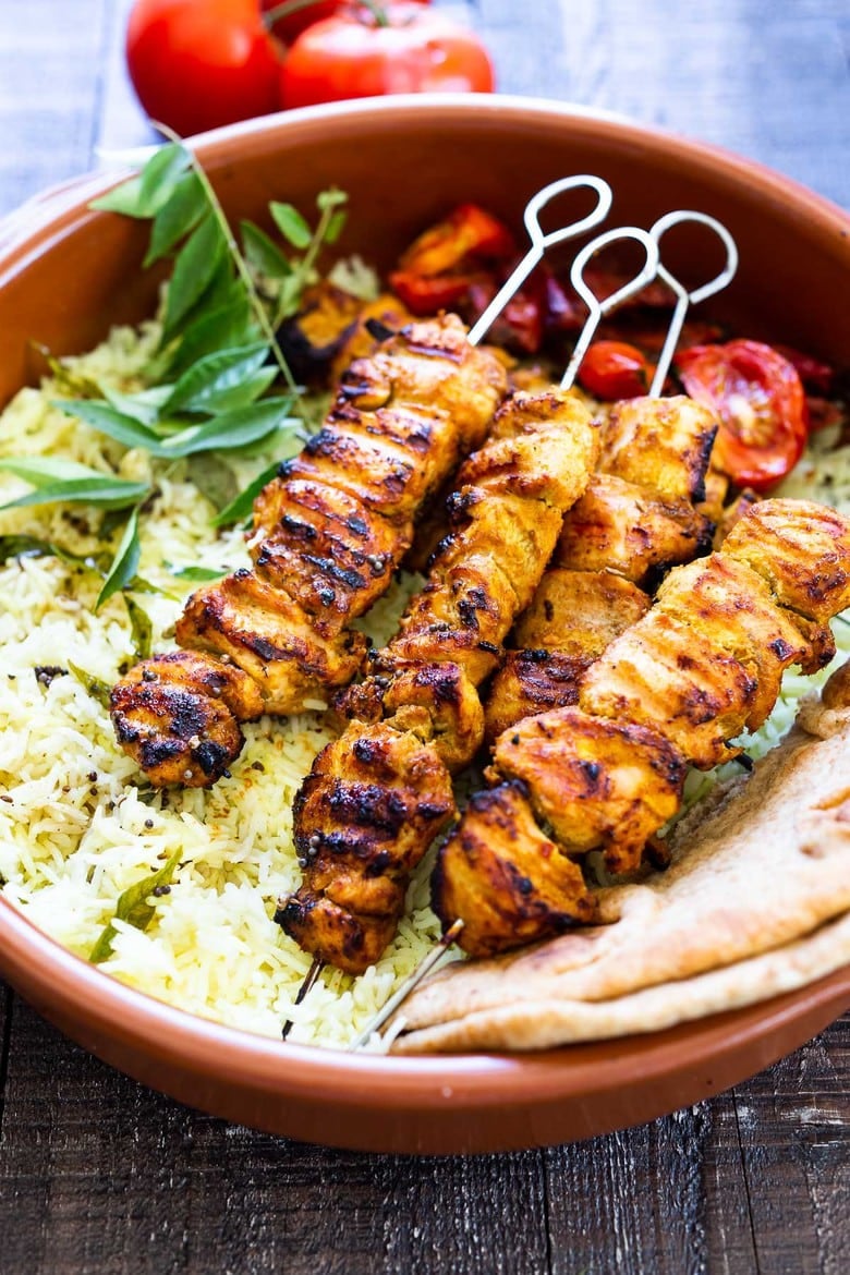 Grilled Tandoori Chicken- an easy authentic Indian recipe with a simple yogurt marinade using chicken thighs. Served with naan and Raita Sauce. #tandoorichicken #grilled #grilledchicken #indianrecipe