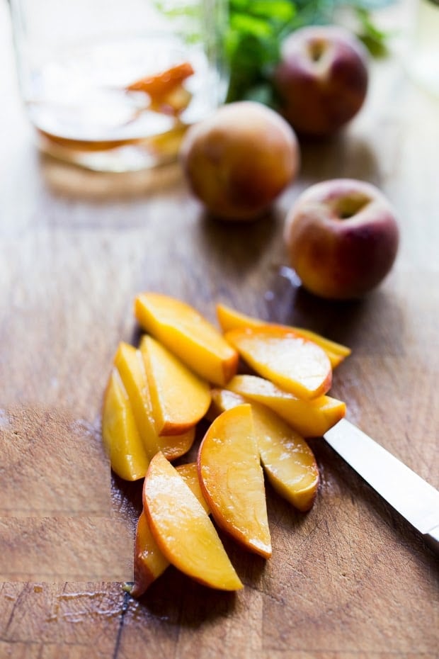 Simple Refreshing Peach Sangria ...a delicious summer drink made with white wine and Elder flower liquor (or syrup) that can be made ahead. Perfect for a crowd! #peachsangria #peach #sangria | www.feastingathome.com
