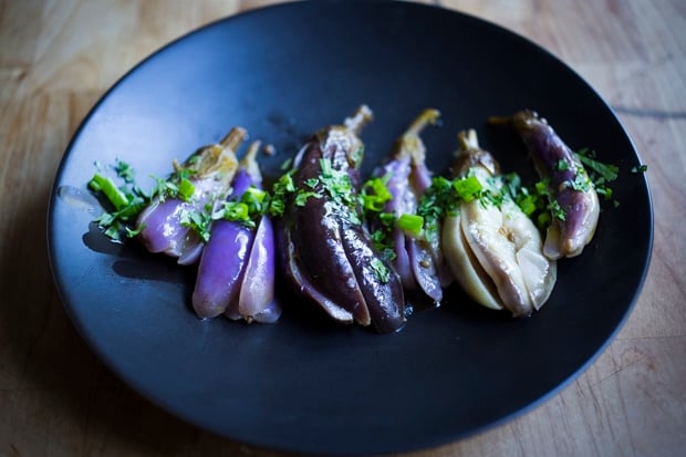 Moroccan pickled eggplant with garlic, coriander and cilantro. Drizzled with olive oil they make the perfect addition to any meal. | www.feastingathome.com.com