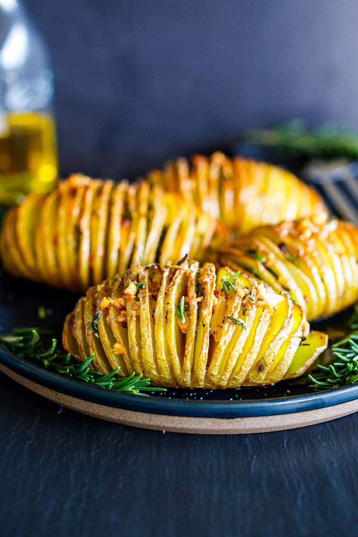 Crispy tender hasselback potatoes with garlic rosemary and olive oil.