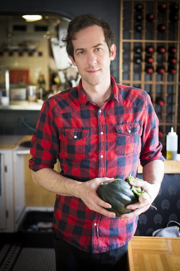 Chef Tony Brown, of Ruins and Stellas Cafe, in Spokane Washington holding an acorn squash.