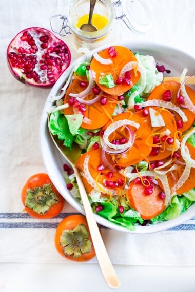 Bright and joyful, this refreshing Persimmon Salad is made with seasonal Fuyu Persimmons, butter lettuce, pomegranate seeds, and shaved fennel tossed in a cheery citrus dressing.