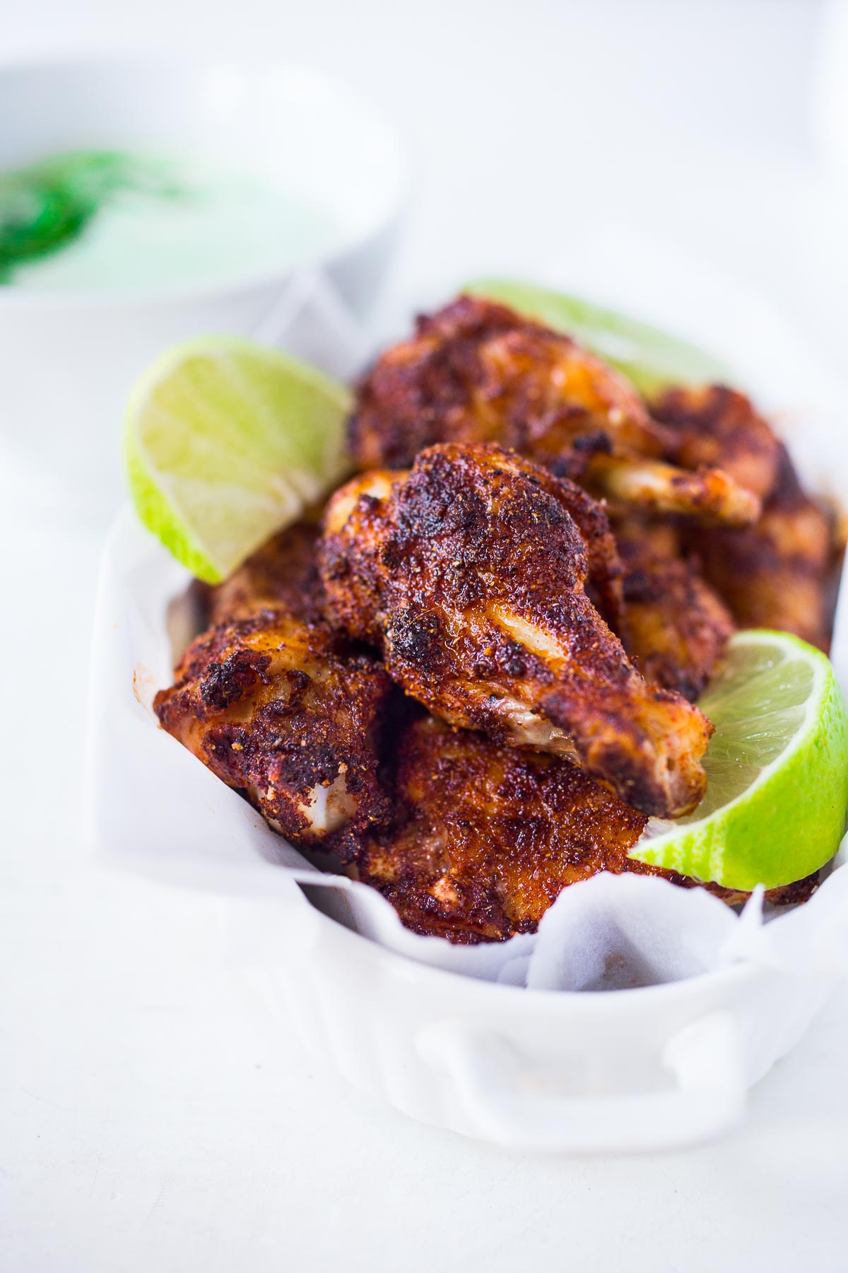 Baked Chicken Wings with a Smoky Chipotle Rub & Creamy Cilantro Dipping Sauce. A fast and healthy approach to chicken wings, packed full of deep smoky flavor! Easy and simple!
