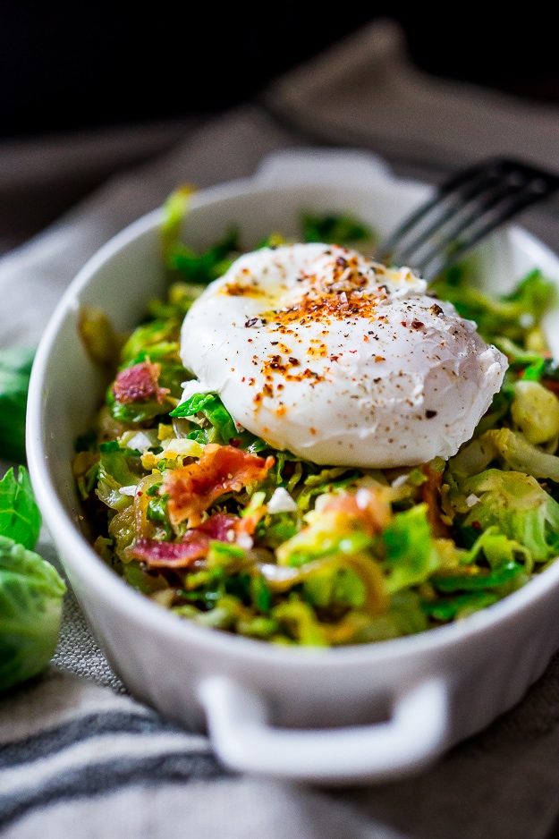 A delicious low-carb breakfast- Brussels sprouts and bacon hash topped with soft pillowy poached eggs. Bacon is optional. See recipe notes for alternatives! 