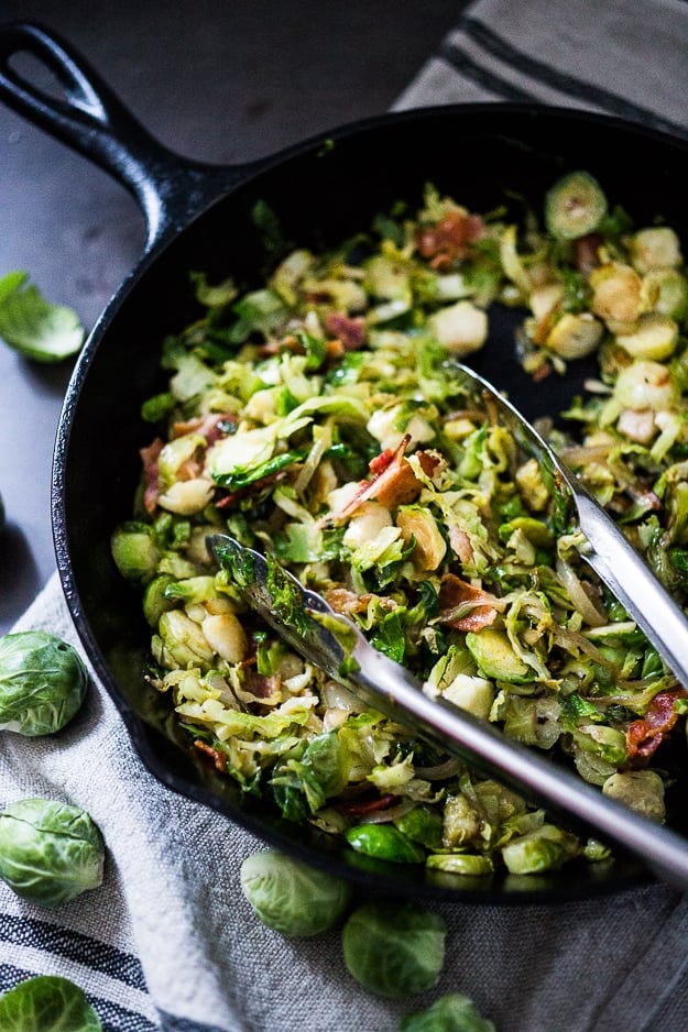 A delicious low-carb breakfast- Brussels sprouts and bacon hash topped with soft pillowy poached eggs. Bacon is optional. See recipe notes for alternatives! 