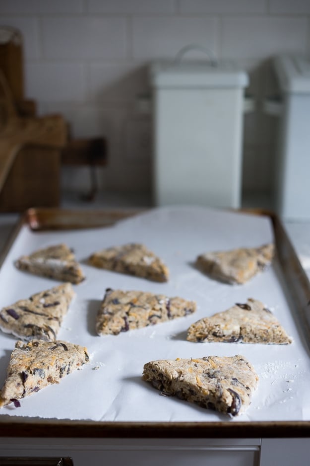 Savory Scones with cheddar cheese and caramelized onions on a sheet pan.