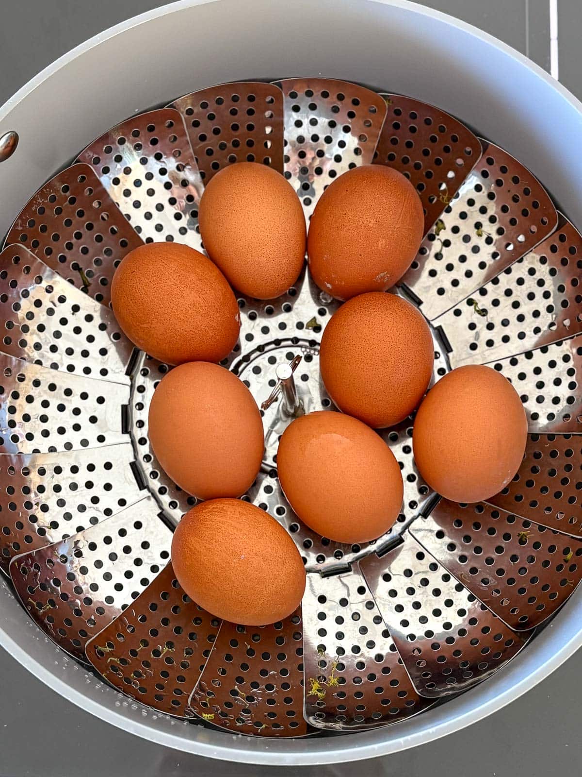 steaming the eggs in a steamer basket. 