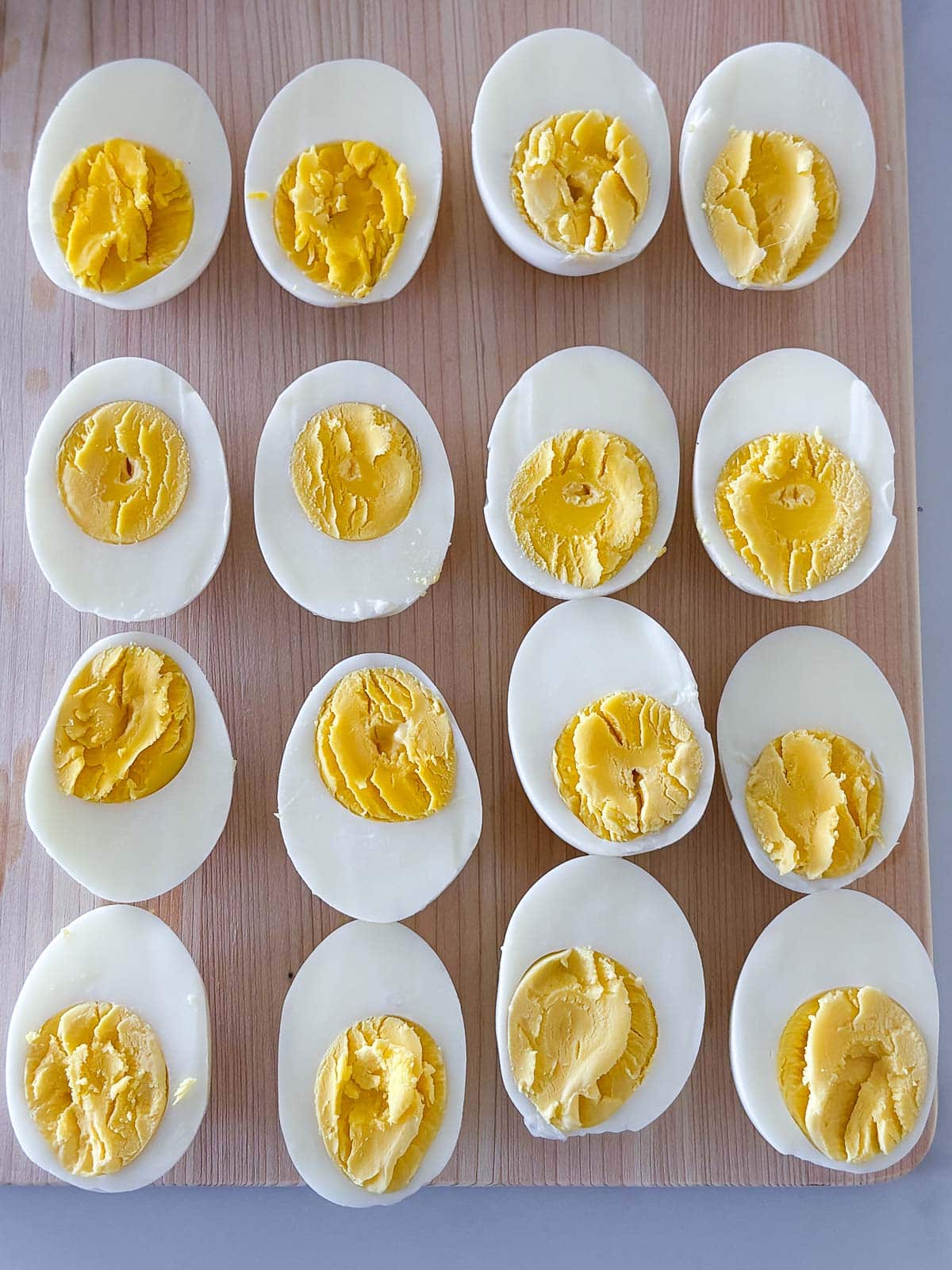 Perfectly cooked hard-boiled eggs (halved) using the steaming method- no greying with creamy centers. 