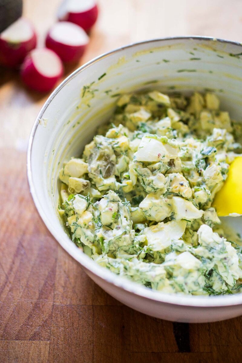 avocado egg salad recipe in a white bowl.