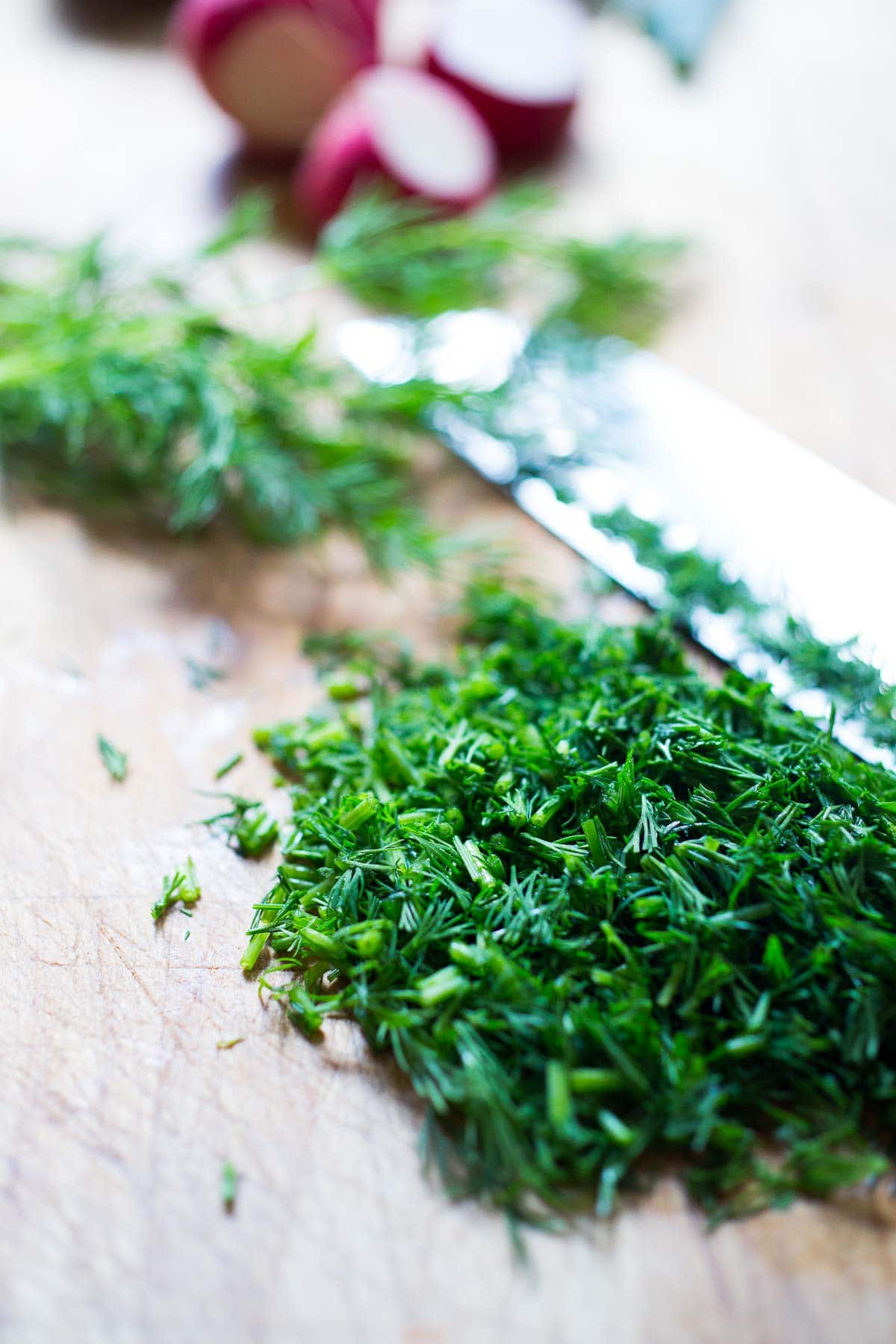 Fresh dill being chopped. 