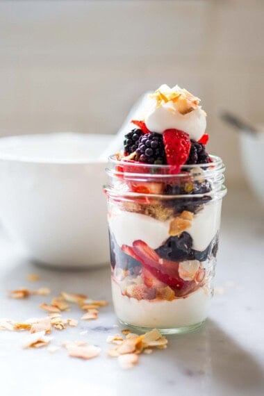 This fresh Berry Trifle recipe is made with lemon cake, fresh berries, toasted coconut and coconut whipped cream. Vegan and delicious, perfect for spring.