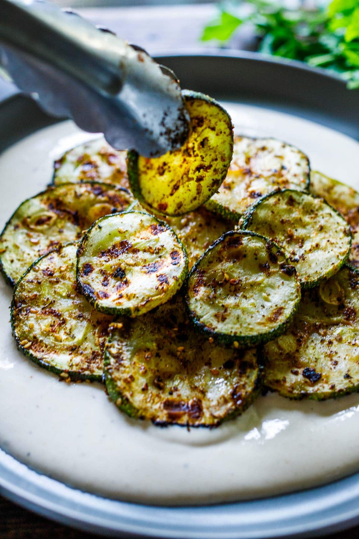 Layering the grilled zucchini.