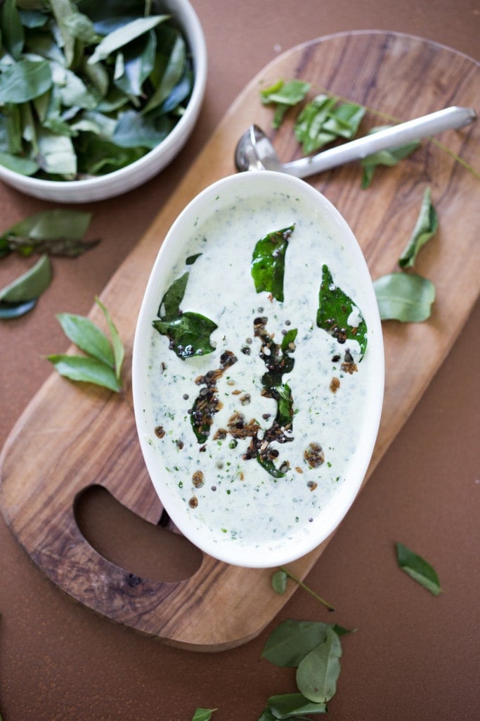 Cilantro yogurt sauce - and an authentic & insanely delicious recipe for Chicken Biryani with Cilantro Yogurt Sauce. Vegetarian option included as well as detailed step by step instructions. | www.feastingathome.com