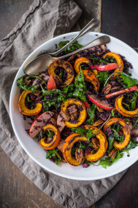 This delicious Thanksgiving Fall Salad with Roasted Pumpkin, Kale, Apples and Wild Rice, is topped with Maple glazed Pecans, Dried Cranberries, and a scrumptious, healthy, Allspice Vinaigrette. Vegan! #thanksgivingsalad #fallsalad #vegansalad #holidaysalad #pumpkin #wildricesalad #kalesalad #applesalad #thanksgiving #salad