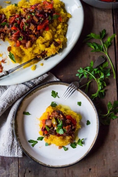 Eggplant Puttanesca over Roasted Spaghetti Squash- vegan, gluten free and delicious! | feastingathome.com