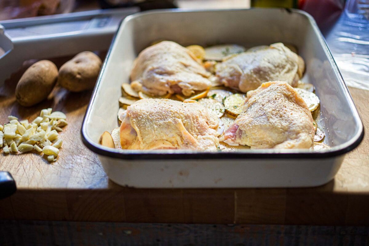 nestle in the chicken thighs on the potatoes. 