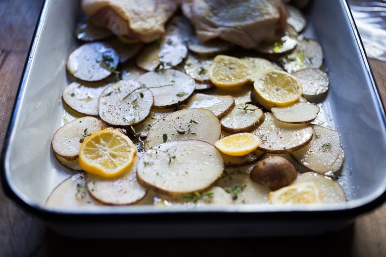 prepping the roasted chicken thigh recipe on a sheet pan. 