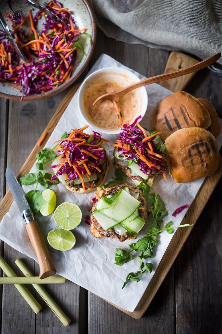 Thai Turkey Burgers on a wood cutting board.