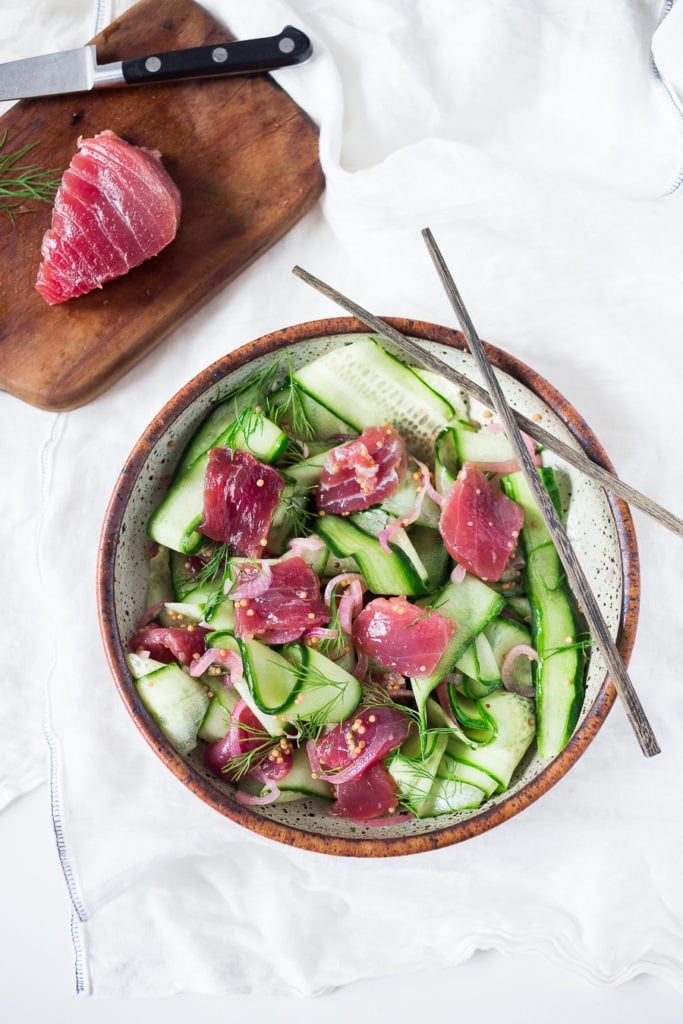 Ahi Salad in a white and brown serving bowl with chop sticks.