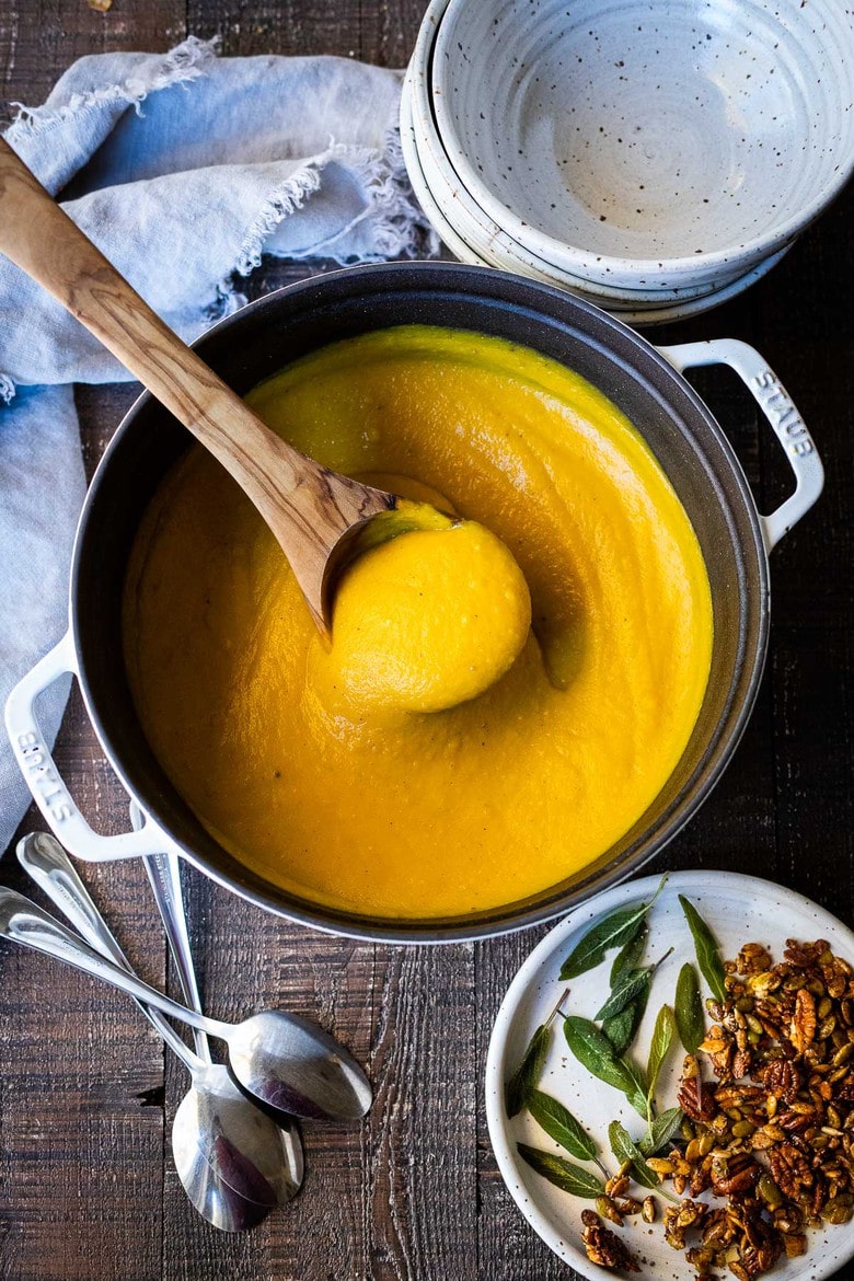 Roasted Butternut Squash Soup. This creamy fall soup is full of flavor and vegan-adaptable and gluten free. | #butternutsoup #butternut #vegan #fallsoup #roastedbutternutsoup www.feastingathome.com