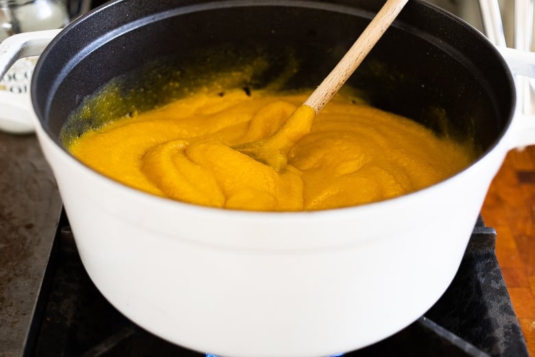 stirring the puree in the pot