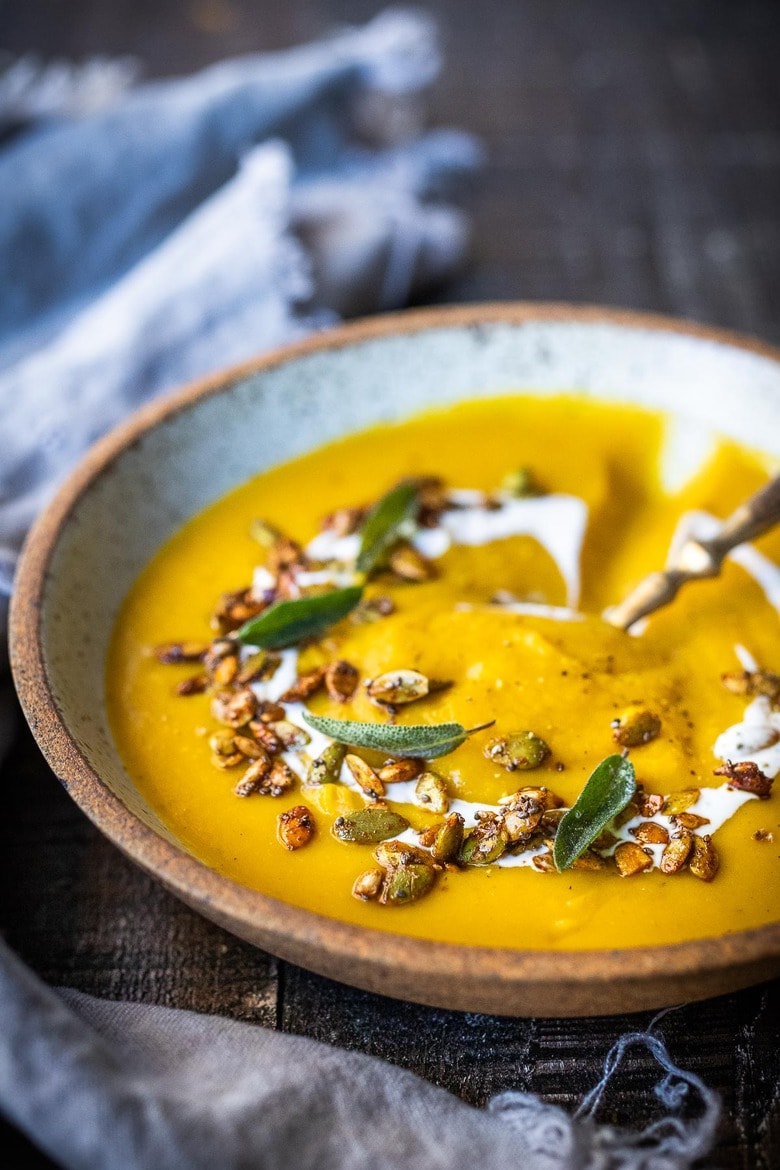 Roasted Butternut Squash Soup. This creamy fall soup is full of flavor and vegan-adaptable and gluten free. | #butternutsoup #butternut #vegan #fallsoup #roastedbutternutsoup www.feastingathome.com