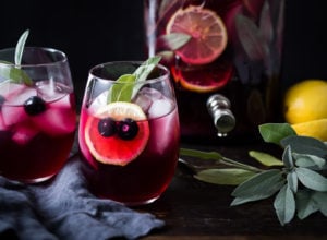 Blueberry Gin and Sage Punch -A refreshing make ahead, holiday punch, with lemon and prosecco - sparkling and effervescent! | www.feastingathome.com #SippingThroughTheSeason #holidaypunch #ginpunch #blueberrypunch #holidaydrinks #easycocktails #makeaheadcocktails #punchalcohol #cocktails #punch
