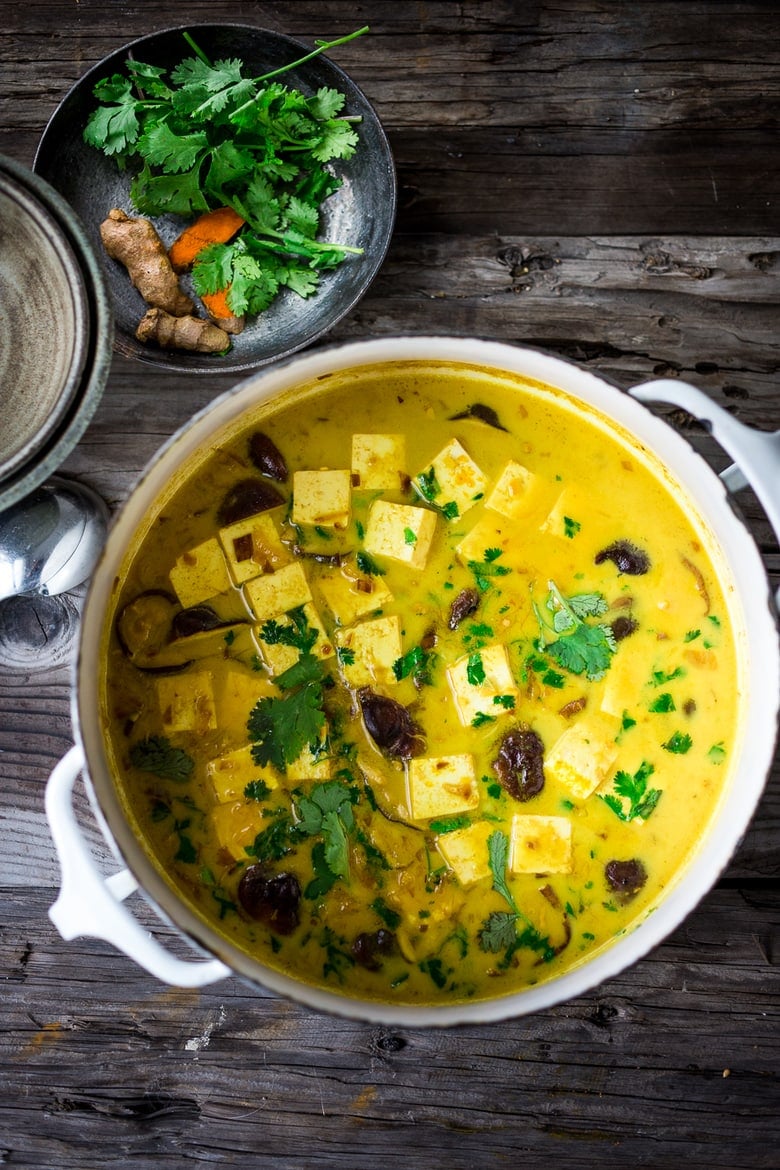 large pot with tofu curry, shiitakes, and cilantro. 
