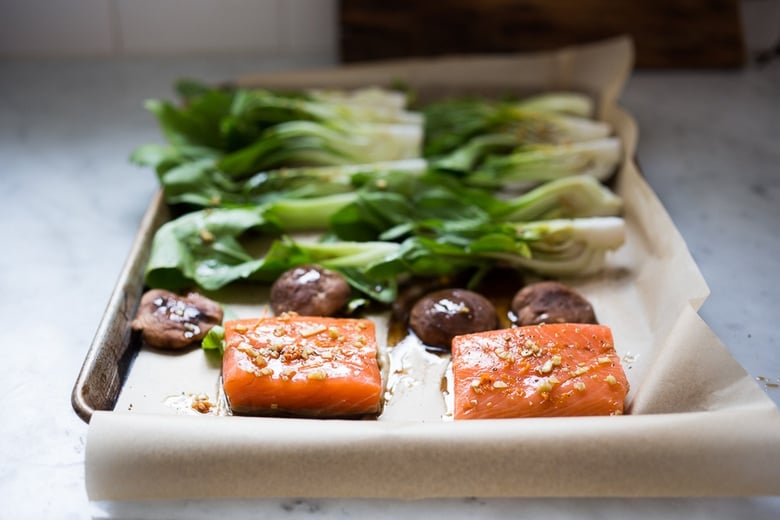 Teriyaki Salmon with Bok Choy baked on a sheet pan with a teriyaki glaze.