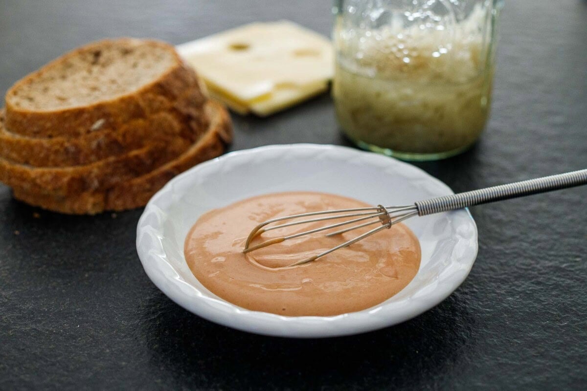 the reuben sauce being whisked in a bowl. 
